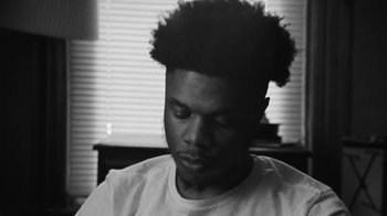 Movie still from “Jurdan Bryant - Words for Thomas” (2019), directed by Alonzo Hellerbach – Close Up shot, Low angle
