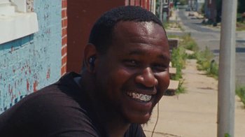 Movie still from “Jurdan Bryant - Words for Thomas” (2019), directed by Alonzo Hellerbach – Close Up shot, Low angle