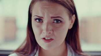 Movie still from “Rain Phoenix - Immolate” (2019), directed by Gus Van Sant – Close Up shot, Low angle