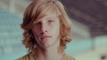 Movie still from “Rain Phoenix - Immolate” (2019), directed by Gus Van Sant – Close Up shot, Low angle