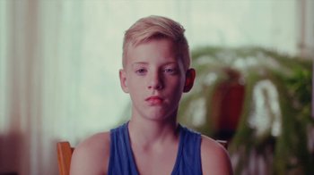 Movie still from “Rain Phoenix - Immolate” (2019), directed by Gus Van Sant – Close Up shot, High angle