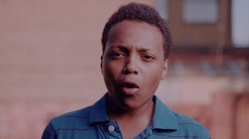 Movie still from “Rain Phoenix - Immolate” (2019), directed by Gus Van Sant – Close Up shot, Low angle