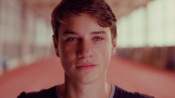 Movie still from “Rain Phoenix - Immolate” (2019), directed by Gus Van Sant – Close Up shot, Low angle