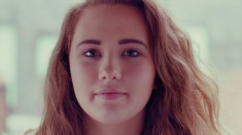 Movie still from “Rain Phoenix - Immolate” (2019), directed by Gus Van Sant – Close Up shot, Low angle