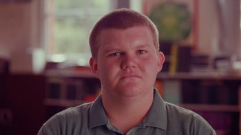 Movie still from “Rain Phoenix - Immolate” (2019), directed by Gus Van Sant – Close Up shot, Low angle