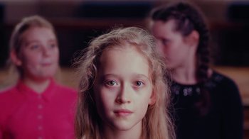 Movie still from “Rain Phoenix - Immolate” (2019), directed by Gus Van Sant – Close Up shot, Low angle