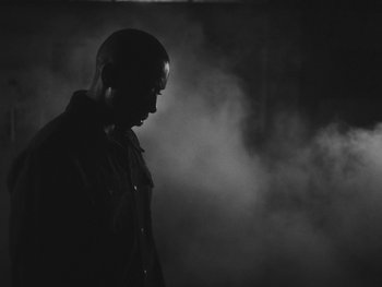 Movie still from “MorMor - Some Place Else” (2019), directed by rubberband. – Close Up shot, Low angle