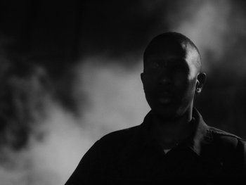 Movie still from “MorMor - Some Place Else” (2019), directed by rubberband. – Close Up shot, Low angle