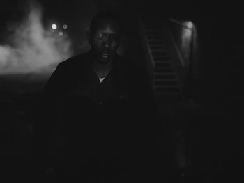 Movie still from “MorMor - Some Place Else” (2019), directed by rubberband. – Close Up shot, Low angle