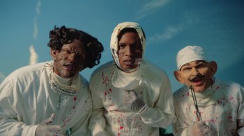 Movie still from “A$AP Rocky - Babushka Boi” (2019), directed by Nadia Lee Cohen – Medium shot, Low angle