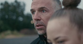Movie still from “Stereophonics - Fly Like An Eagle” (2019), directed by Charlotte Regan – Extreme Close Up shot, Over the shoulder angle