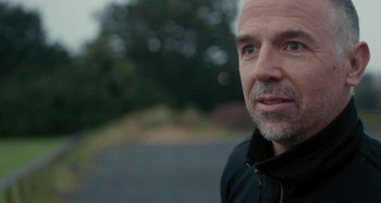 Movie still from “Stereophonics - Fly Like An Eagle” (2019), directed by Charlotte Regan – Close Up shot, Low angle