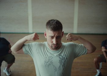 Movie still from “Elderbrook & Rudimental - Something About You” (2019), directed by Luke Davies – Medium shot, Low angle