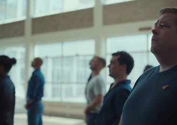 Movie still from “Elderbrook & Rudimental - Something About You” (2019), directed by Luke Davies – Medium shot, Low angle