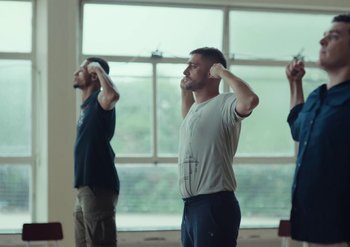 Movie still from “Elderbrook & Rudimental - Something About You” (2019), directed by Luke Davies – Medium shot, Low angle