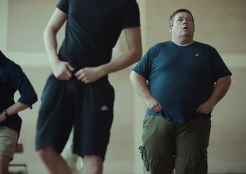 Movie still from “Elderbrook & Rudimental - Something About You” (2019), directed by Luke Davies – Medium shot, Low angle