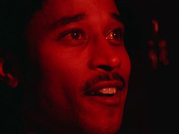 Movie still from “James Blake - Can’t Believe The Way We Flow” (2019), directed by Frank Lebon – Close Up shot, Low angle