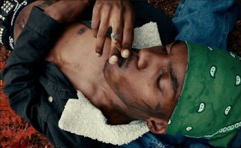 Movie still from “A$AP Ferg - Floor Seats” (2019), directed by Valentin Petit – Medium shot, Overhead angle