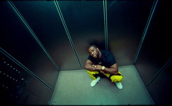 Movie still from “A$AP Ferg - Floor Seats” (2019), directed by Valentin Petit – Medium shot, Overhead angle