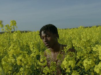 Movie still from “Kelsey Lu - Foreign Car” (2019), directed by Vincent Haycock – Medium shot, Low angle