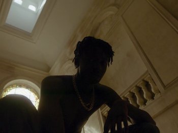 Movie still from “Kelsey Lu - Foreign Car” (2019), directed by Vincent Haycock – Medium shot, Low angle