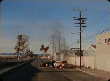 Movie still from “James Blake feat. Rosalía - Barefoot In The Park” (2019), directed by Diana Kunst – Extreme Wide shot, High angle