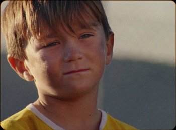 Movie still from “James Blake feat. Rosalía - Barefoot In The Park” (2019), directed by Diana Kunst – Close Up shot, Low angle