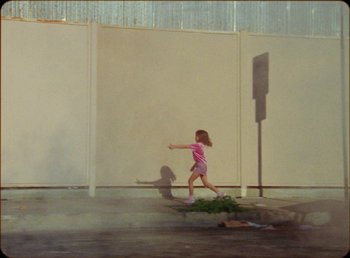 Movie still from “James Blake feat. Rosalía - Barefoot In The Park” (2019), directed by Diana Kunst – Wide shot, Low angle