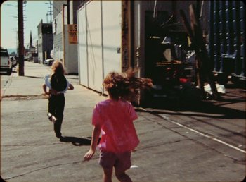 Movie still from “James Blake feat. Rosalía - Barefoot In The Park” (2019), directed by Diana Kunst – Wide shot, High angle