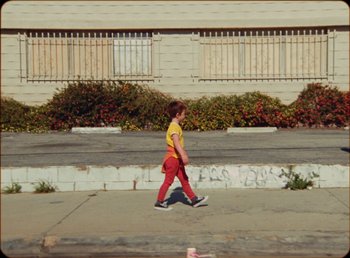 Movie still from “James Blake feat. Rosalía - Barefoot In The Park” (2019), directed by Diana Kunst – Wide shot, Low angle