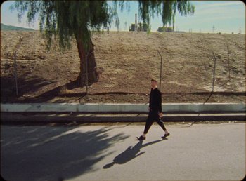 Movie still from “James Blake feat. Rosalía - Barefoot In The Park” (2019), directed by Diana Kunst – Extreme Wide shot, High angle