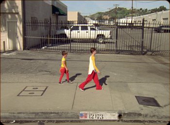 Movie still from “James Blake feat. Rosalía - Barefoot In The Park” (2019), directed by Diana Kunst – Extreme Wide shot, High angle