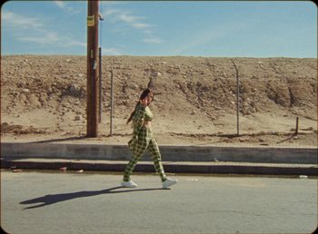 Movie still from “James Blake feat. Rosalía - Barefoot In The Park” (2019), directed by Diana Kunst – Wide shot, High angle