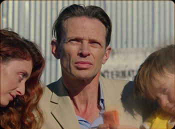 Movie still from “James Blake feat. Rosalía - Barefoot In The Park” (2019), directed by Diana Kunst – Close Up shot, Low angle