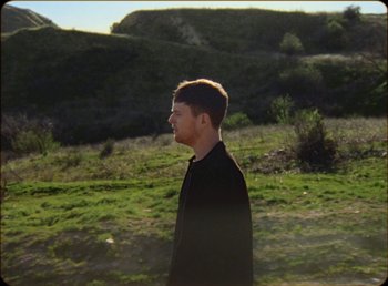 Movie still from “James Blake feat. Rosalía - Barefoot In The Park” (2019), directed by Diana Kunst – Extreme Wide shot, High angle