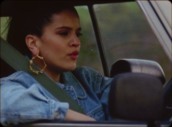 Movie still from “James Blake feat. Rosalía - Barefoot In The Park” (2019), directed by Diana Kunst – Close Up shot, Low angle