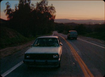 Movie still from “James Blake feat. Rosalía - Barefoot In The Park” (2019), directed by Diana Kunst – Extreme Wide shot, High angle