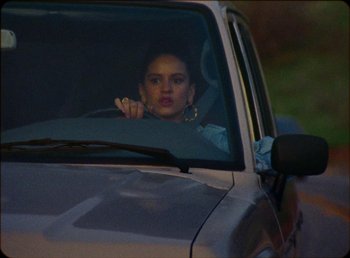 Movie still from “James Blake feat. Rosalía - Barefoot In The Park” (2019), directed by Diana Kunst – Close Up shot, Low angle