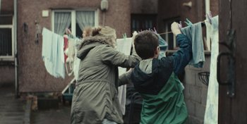 Movie still from “Mumford & Sons - Beloved” (2019), directed by Charlotte Regan – Medium shot, Low angle