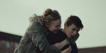 Movie still from “Mumford & Sons - Beloved” (2019), directed by Charlotte Regan – Close Up shot, Over the shoulder angle