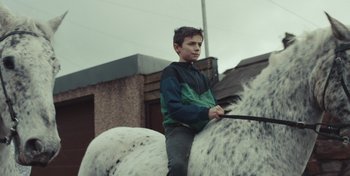 Movie still from “Mumford & Sons - Beloved” (2019), directed by Charlotte Regan – Medium shot, Low angle