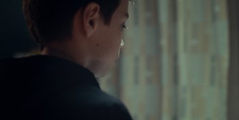 Movie still from “Mumford & Sons - Beloved” (2019), directed by Charlotte Regan – Extreme Close Up shot, Over the shoulder angle