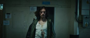 Movie still from “Hozier - Movement” (2018), directed by Us – Medium shot, Low angle