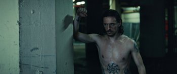 Movie still from “Hozier - Movement” (2018), directed by Us – Medium shot, Low angle