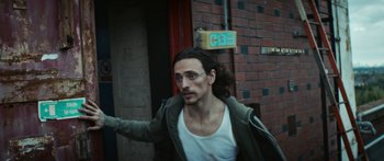 Movie still from “Hozier - Movement” (2018), directed by Us – Medium shot, Low angle