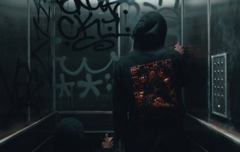 Movie still from “Wilkinson - I Need” (2018), directed by Charlotte Regan – Medium shot, Overhead angle