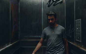 Movie still from “Wilkinson - I Need” (2018), directed by Charlotte Regan – Medium shot, Low angle