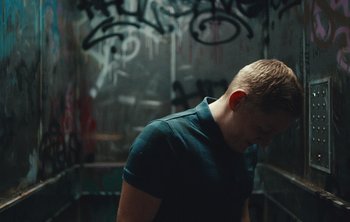 Movie still from “Wilkinson - I Need” (2018), directed by Charlotte Regan – Medium shot, Low angle