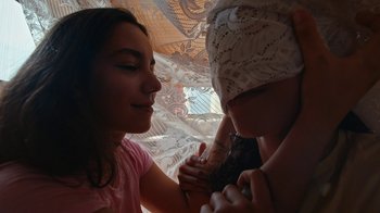Movie still from “The Blaze - Queens” (2018), directed by The Blaze – Close Up shot, Over the shoulder angle