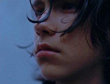 Movie still from “Kenzie - Funeral” (2018), directed by Camille Summers-Valli – Extreme Close Up shot, Low angle